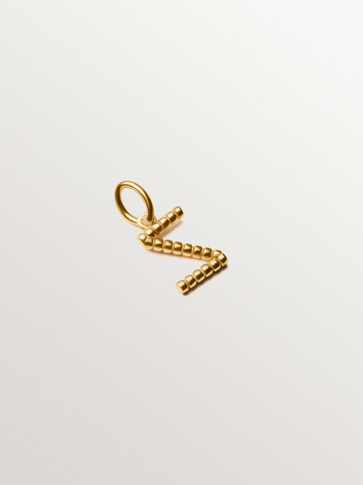 Charm de plata 925 bañada en oro amarillo de 18K con letra Z y motivos de esferas