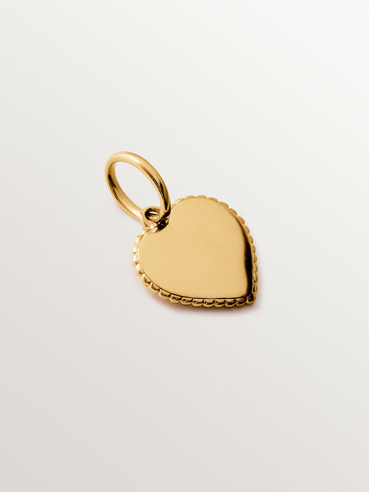Charm corazón de plata bañada en oro amarillo de 18K