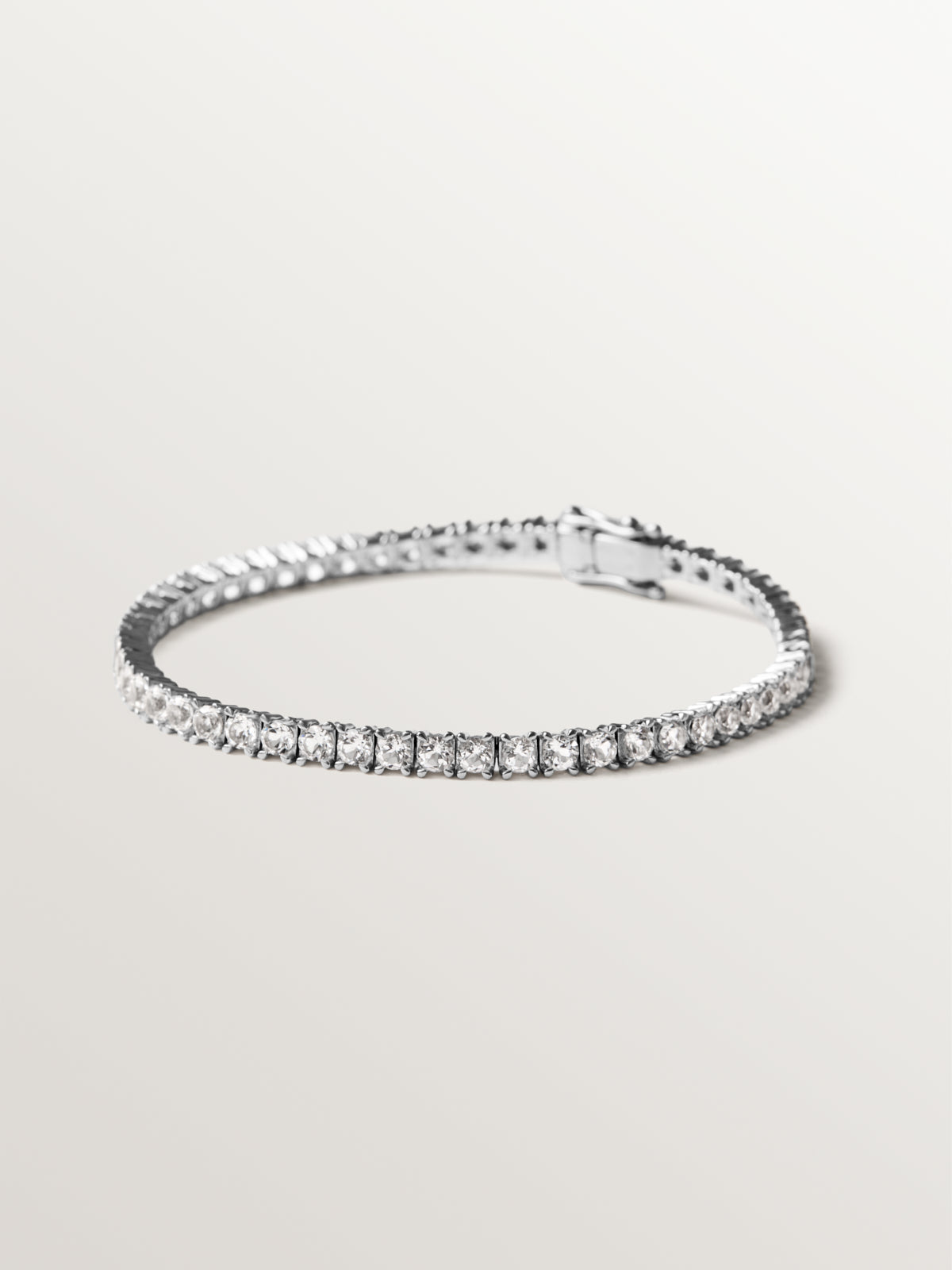 Thick rivière bracelet in 925 silver with white topaz