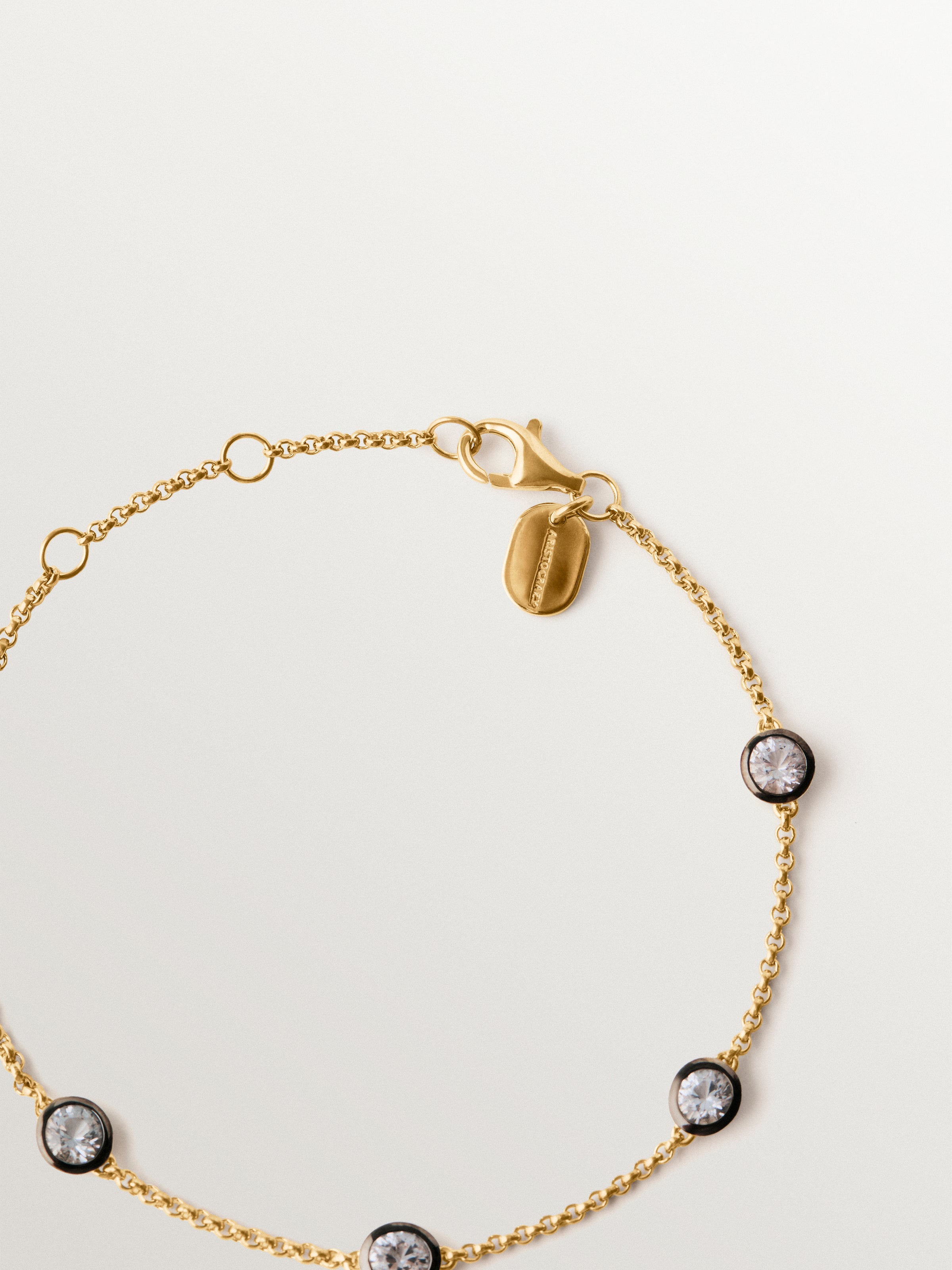 Pulsera bicolor de plata 925 bañada en oro amarillo de 18K con topacios blancos
