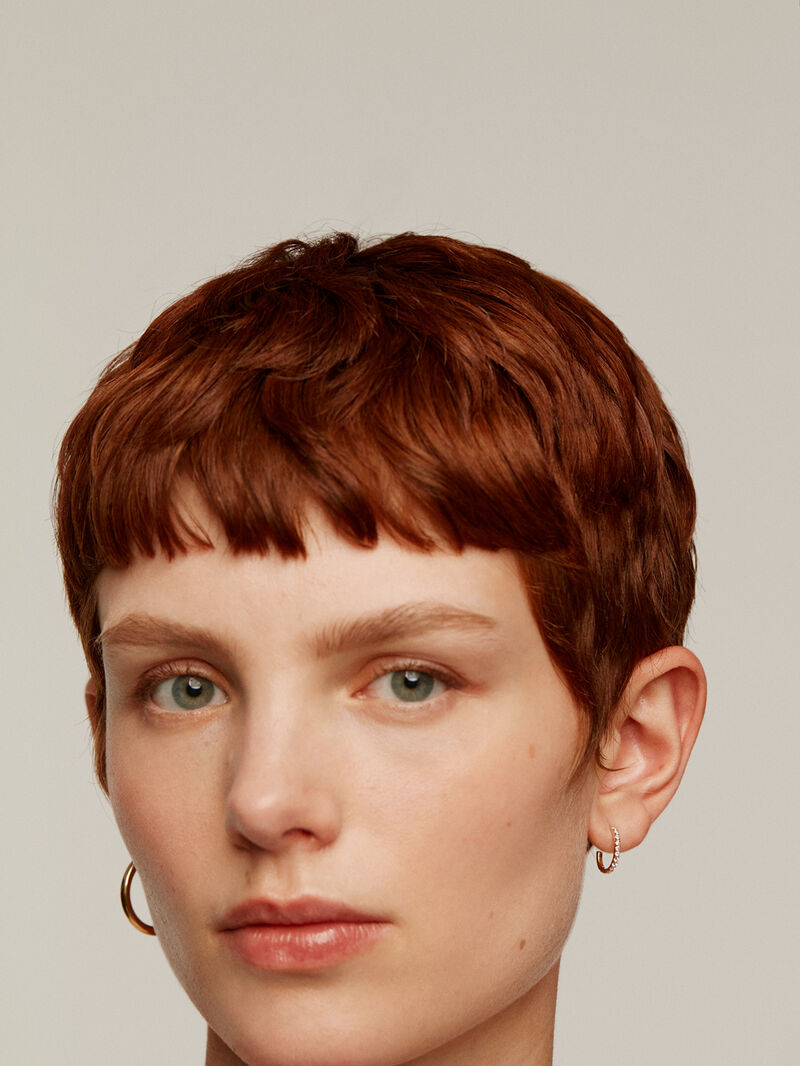 Individual small hoop earring made of 18K yellow gold with 0.20cts diamonds. image number 5