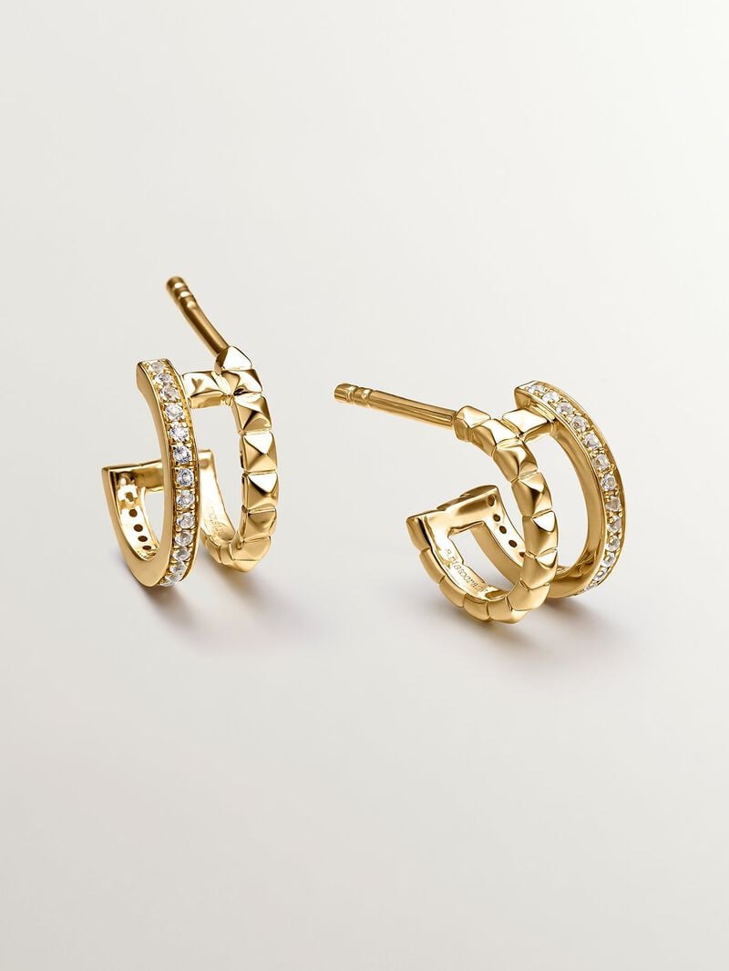Small double hoop earrings made from 925 silver bathed in 18K yellow gold with embossing and white topazes. image number 4