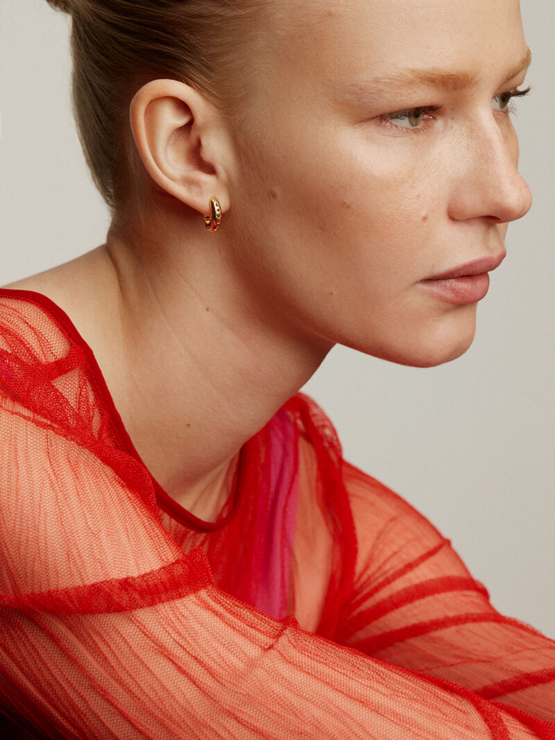 Thick hoop earrings made of 925 silver, coated in 18K yellow gold, with stars. image number 1