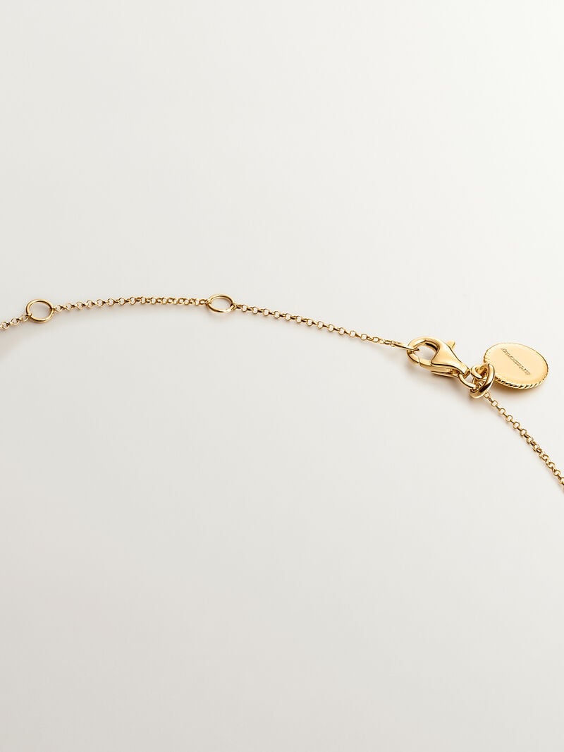 925 Silver pendant bathed in 18K yellow gold with sky blue topaz. image number 6