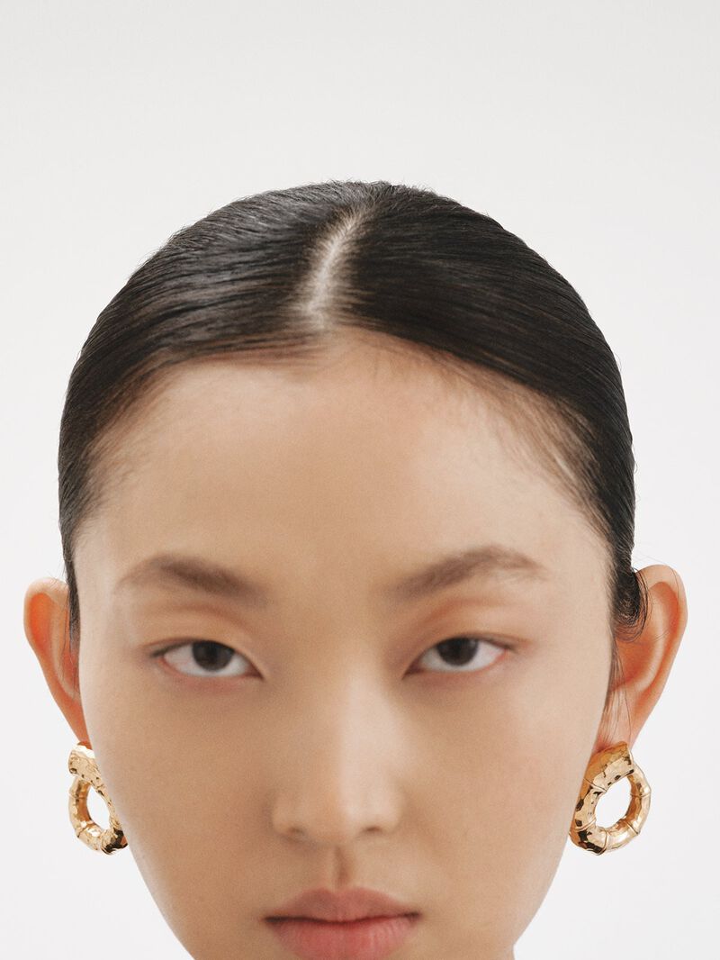 Large hoop earrings made of 925 silver, bathed in 18K yellow gold with a bamboo texture. image number 3