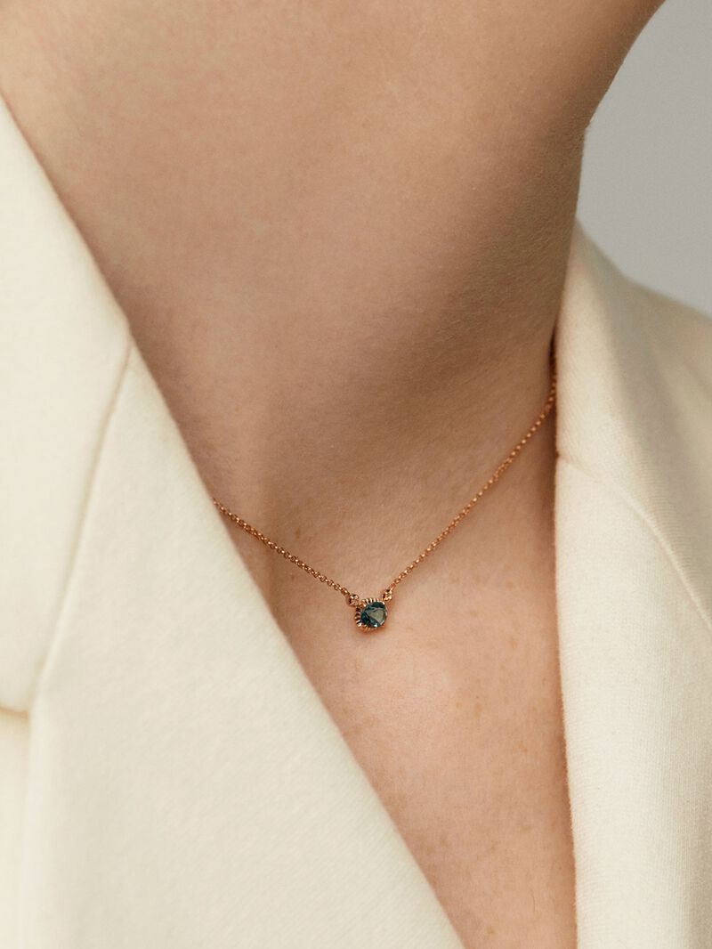 925 Silver pendant dipped in 18K rose gold with London blue and white topazes. image number 2