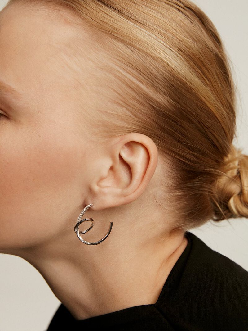 Double hoop earrings made of 925 silver with white topazes and black spinels. image number 3