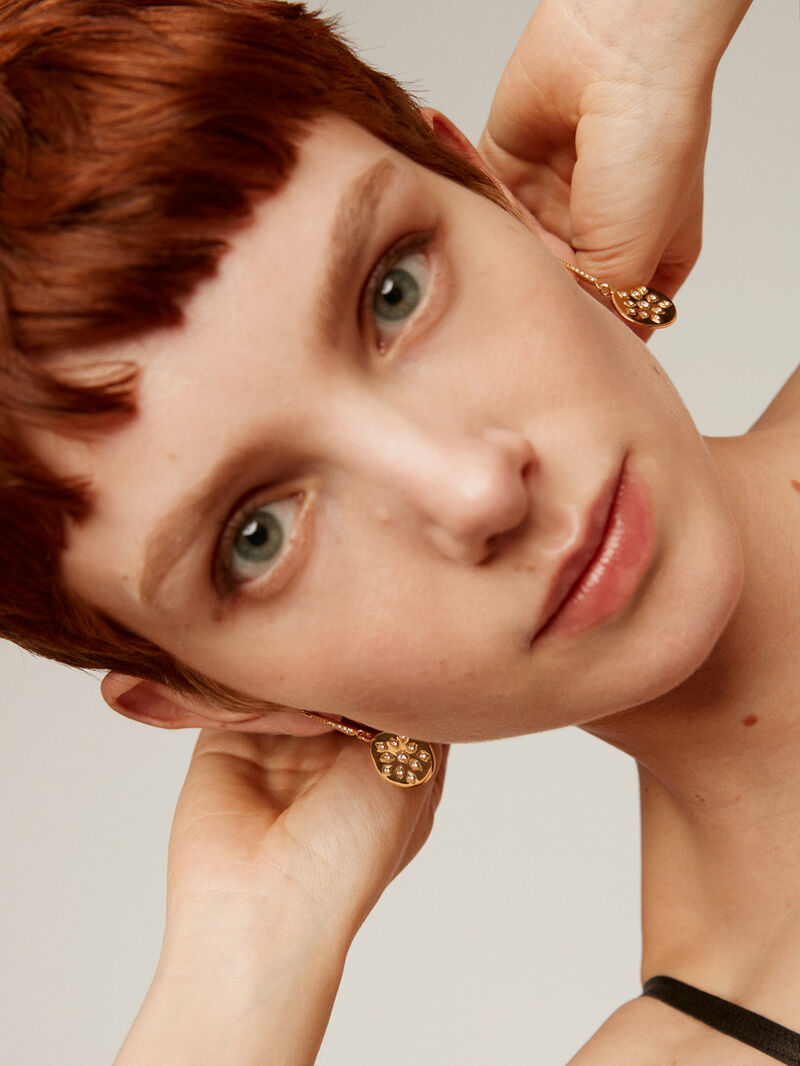 925 silver earrings bathed in 18K yellow gold with an irregular medal shape and white topaz. image number 1
