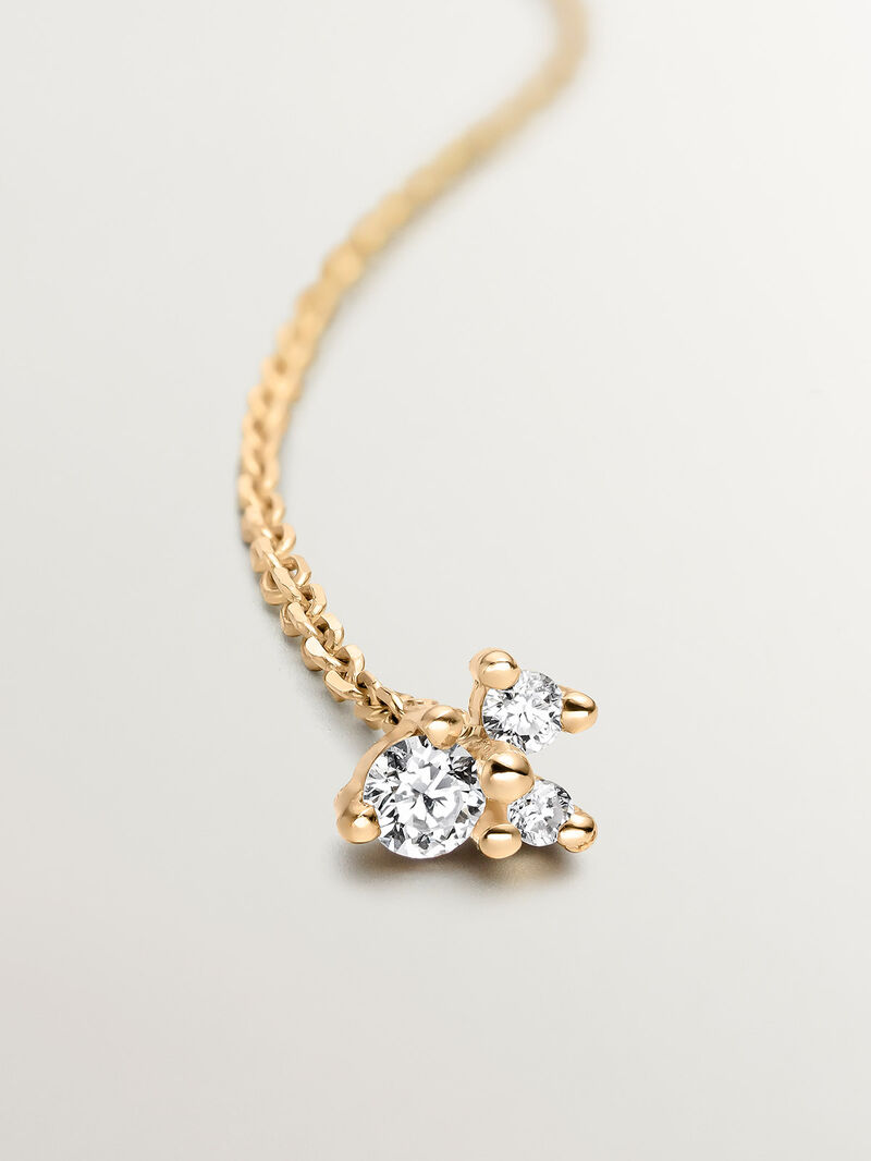 Single 9K yellow gold earring with chain and diamonds. image number 0