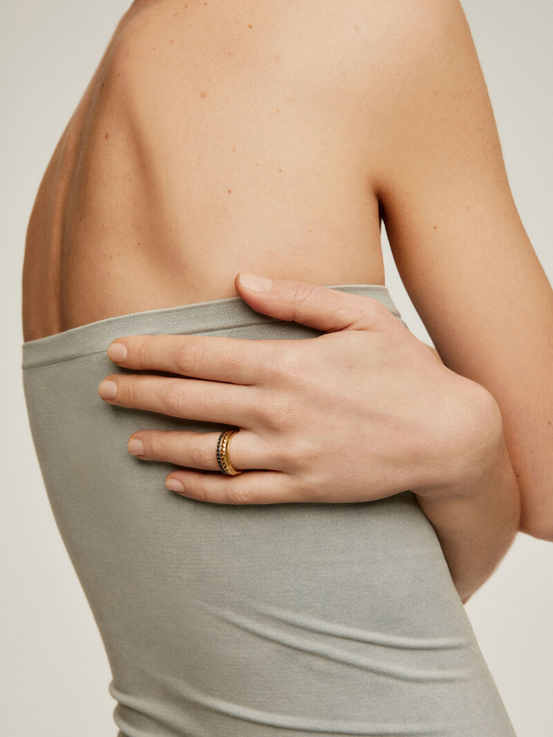 Wide 925 silver ring bathed in 18K yellow gold with texture and black spinels. image number 1