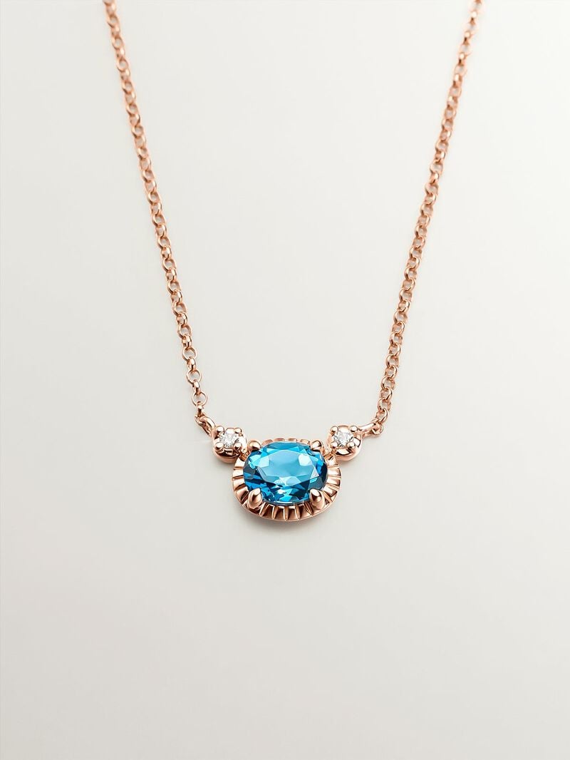 925 Silver pendant dipped in 18K rose gold with London blue and white topazes. image number 0
