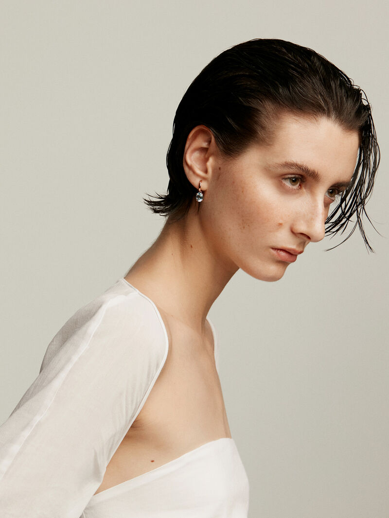 925 Silver earrings plated in 18K rose gold with sky blue topaz. image number 3