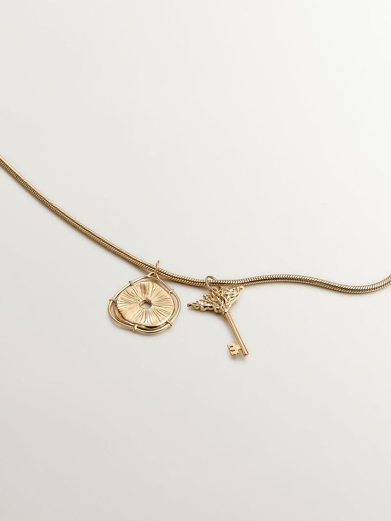 925 Silver charm, gold-plated in 18K yellow gold, with an irregular medallion shape and white topaz stones. image number 4