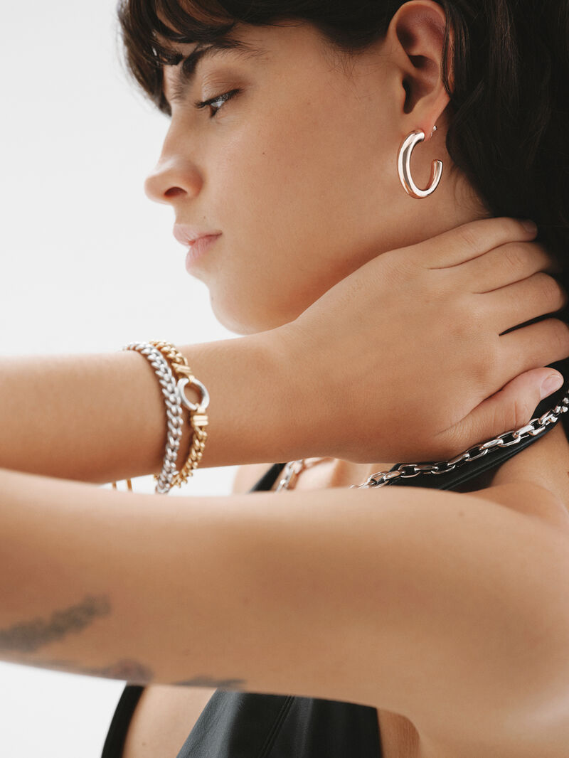 Large and thick 925 silver hoop earrings bathed in 18K rose gold with an oval shape. image number 3