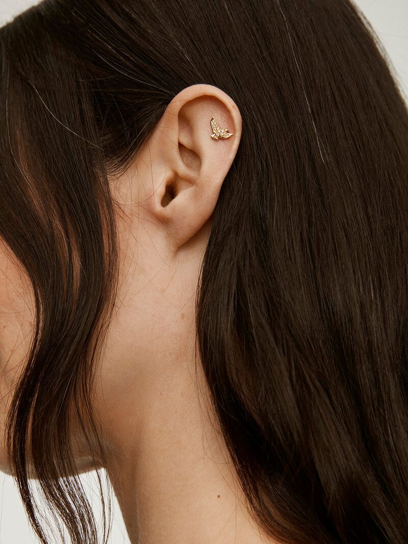 Individual 18K yellow gold earring with eagle shape and diamonds. image number 2