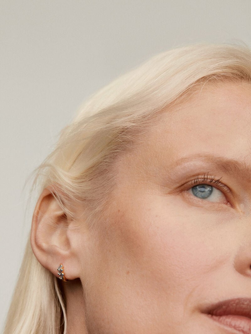 Individual hoop earring made of 925 silver, bathed in 18K yellow gold with sky blue topaz. image number 1