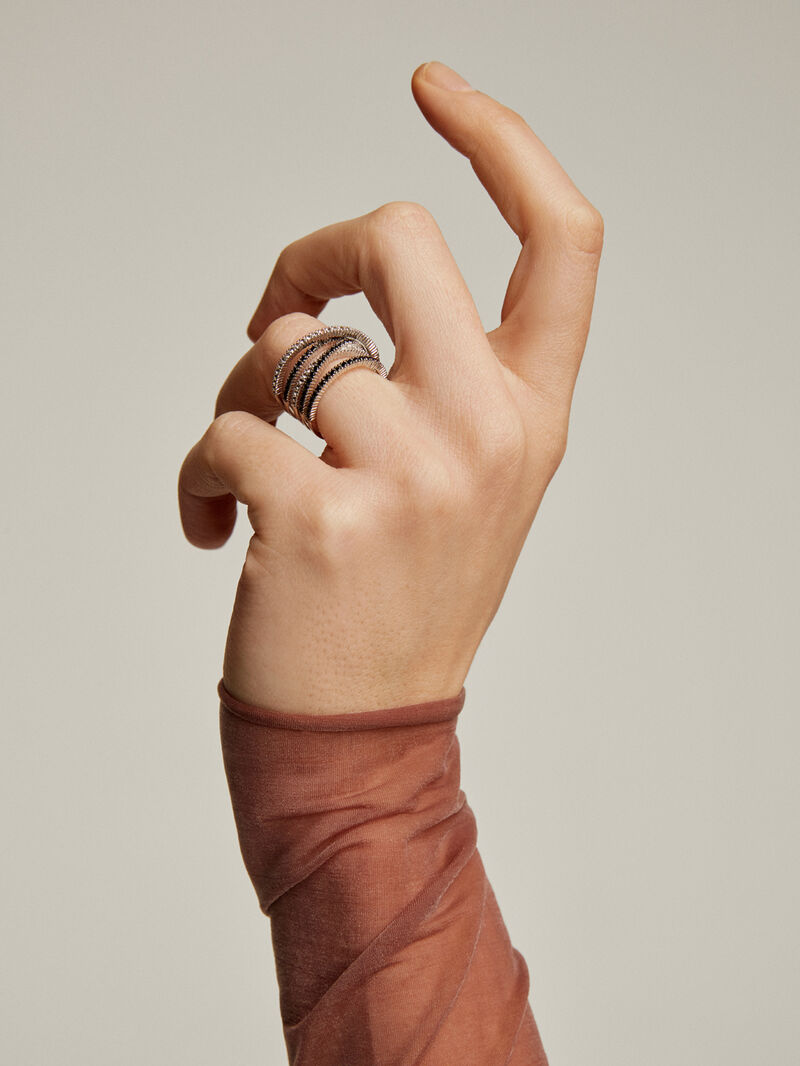 Crossed multi-arm 925 silver ring with white topazes and black spinels. image number 1