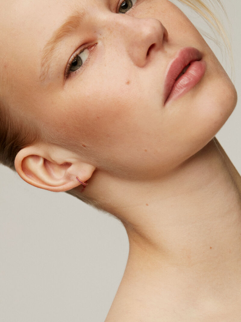 Single small hoop earring in 9k rose gold with rubies. image number 1