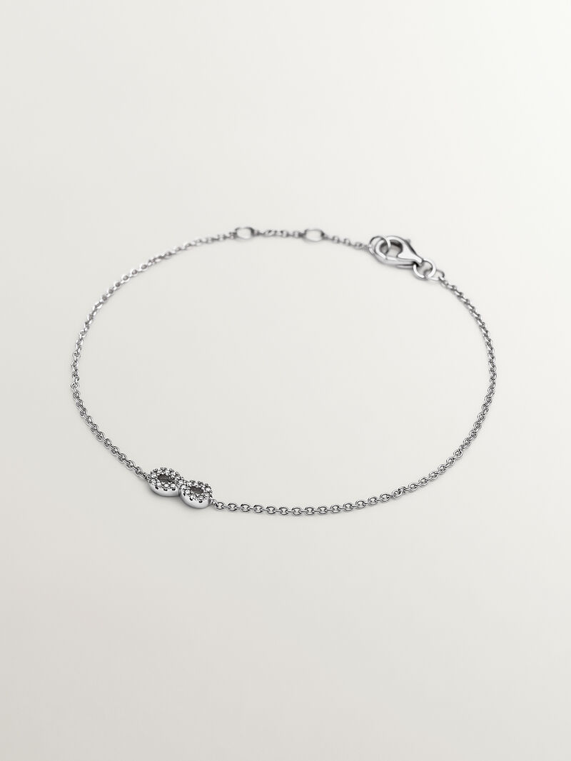 18K white gold bracelet with infinity and diamonds image number 0
