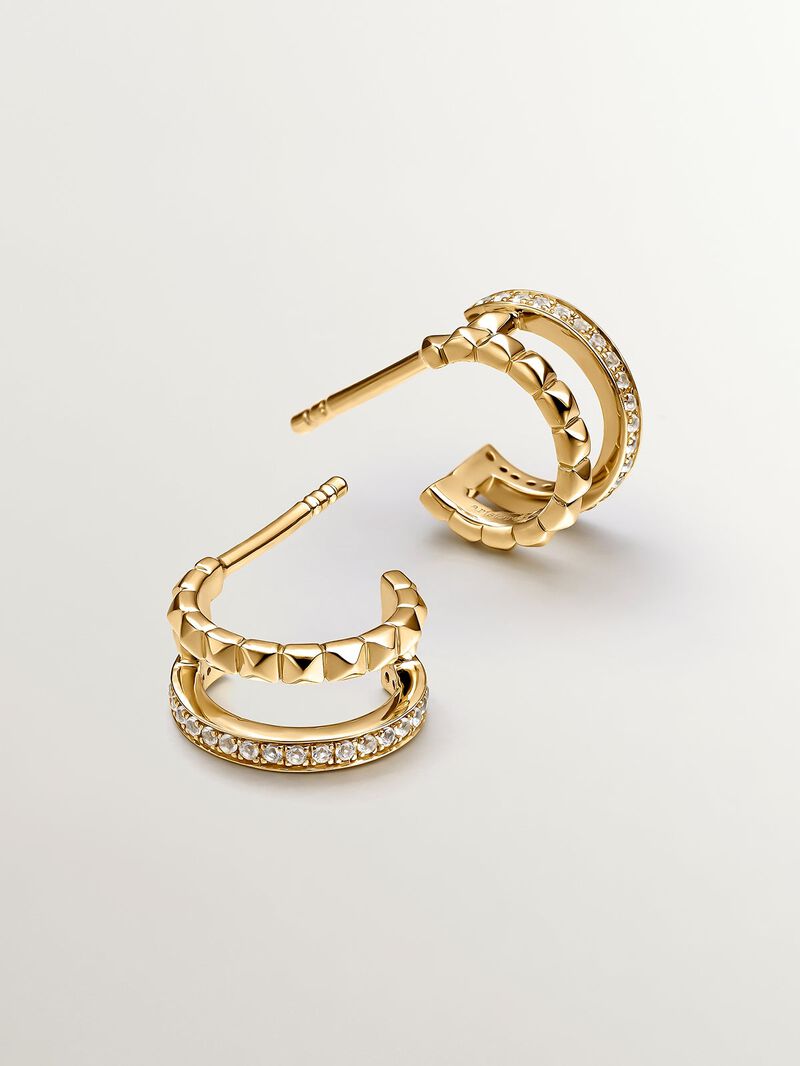 Small double hoop earrings made from 925 silver bathed in 18K yellow gold with embossing and white topazes. image number 0
