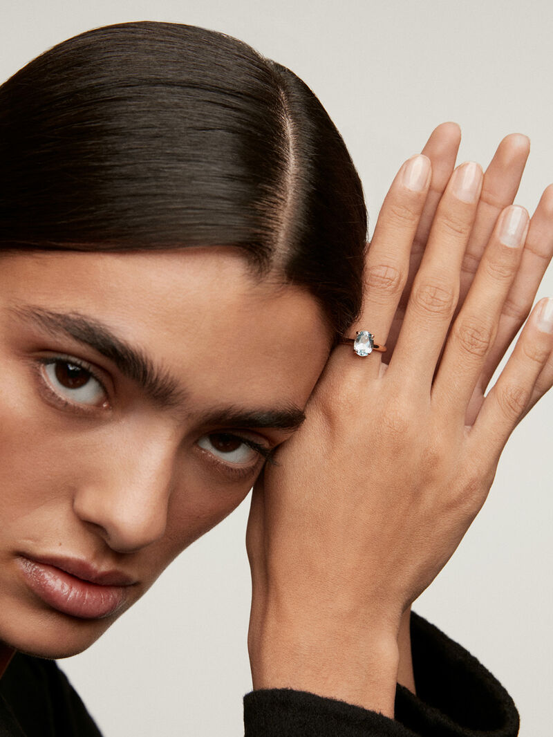 Medium-sized 925 silver hoop earrings plated in 18K rose gold with sky blue topaz. image number 1