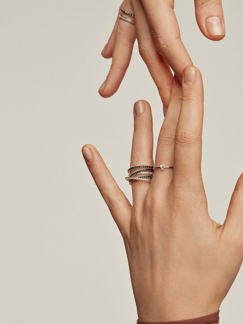 Crossed multi-arm 925 silver ring with white topazes and black spinels. image number 5