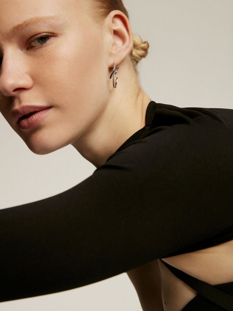 Double hoop earrings made of 925 silver with white topazes and black spinels. image number 1