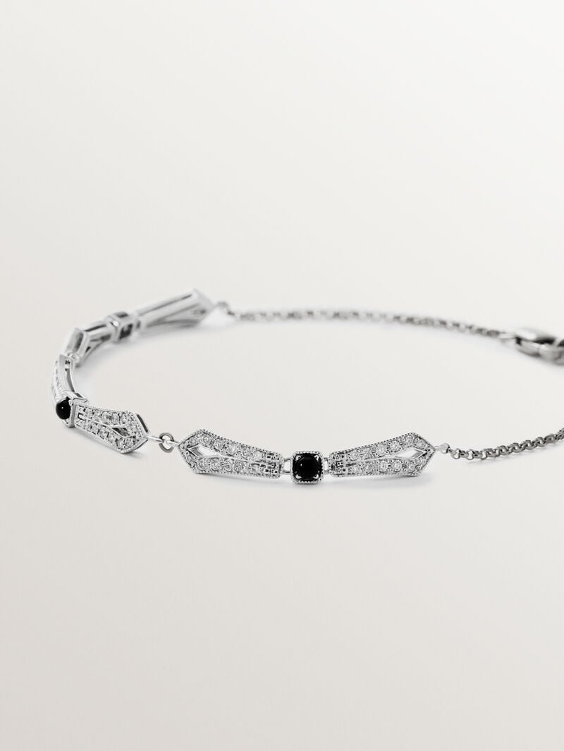 Pulsera de oro blanco de 18K con ónix negro y diamantes en talla brillante image number 1