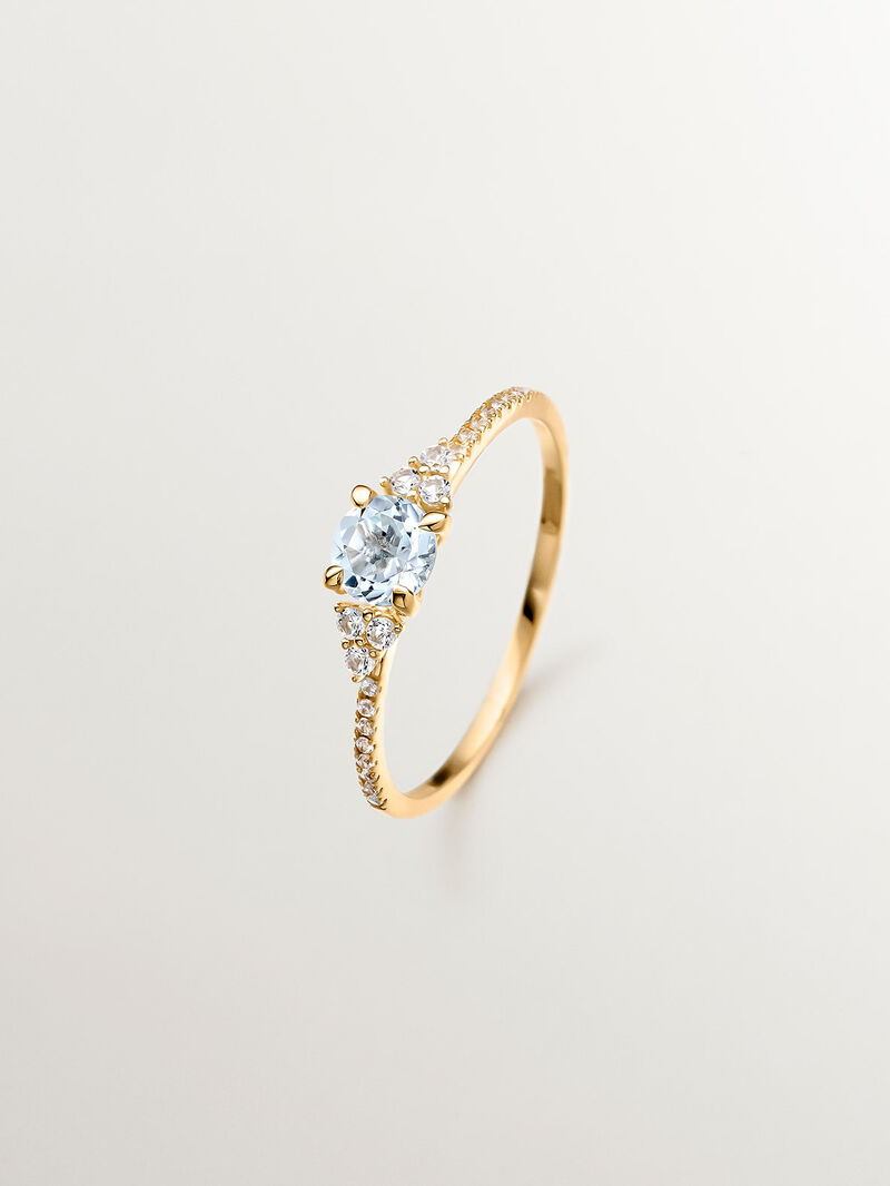 925 Silver ring bathed in 18K yellow gold with sky blue topaz and white sapphires. image number 0