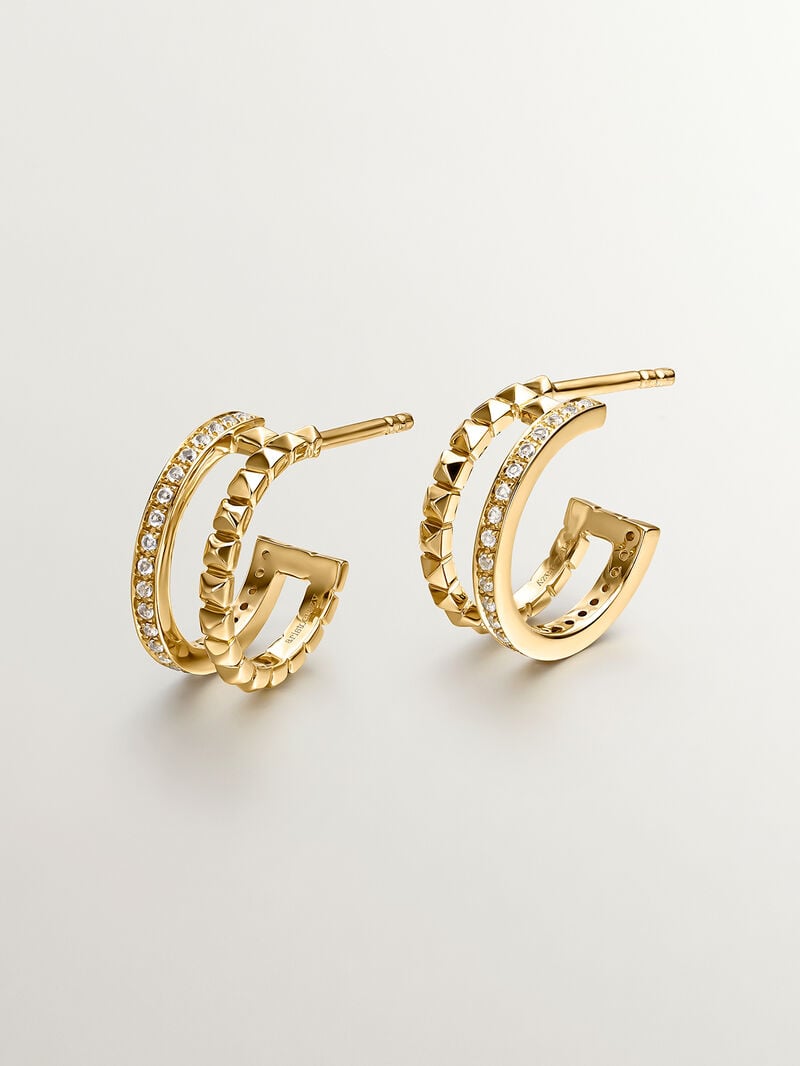 Double hoop earrings made of 925 silver plated in 18K yellow gold with embossing and white topaz. image number 2