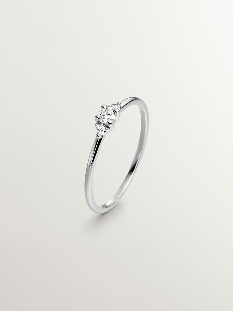 18K white gold triple ring with 0.10 ct central diamond and diamonds image number 0