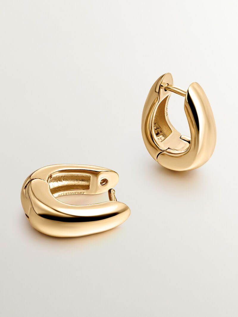 Medium thick 925 silver hoop earrings bathed in 18K yellow gold with an oval shape. image number 2
