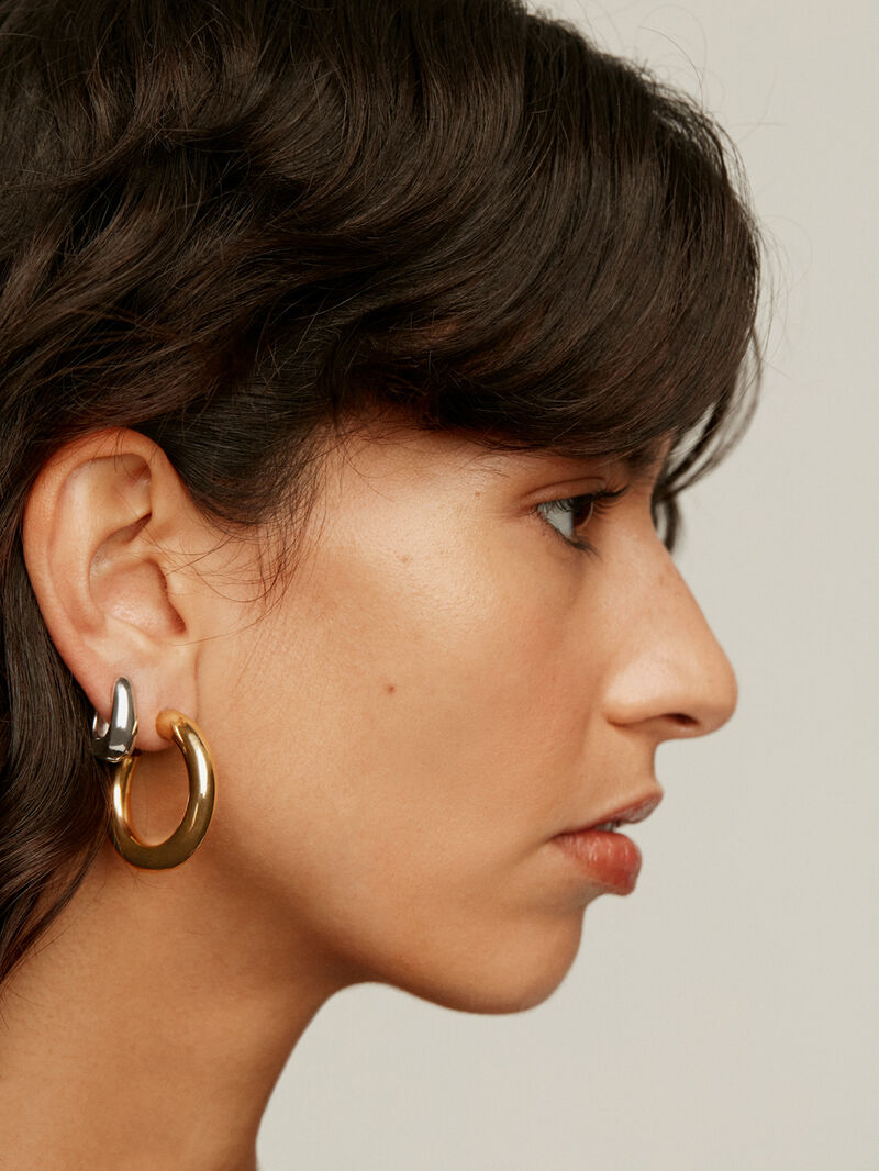 Medium-sized thick 925 silver hoop earrings with an oval shape. image number 3