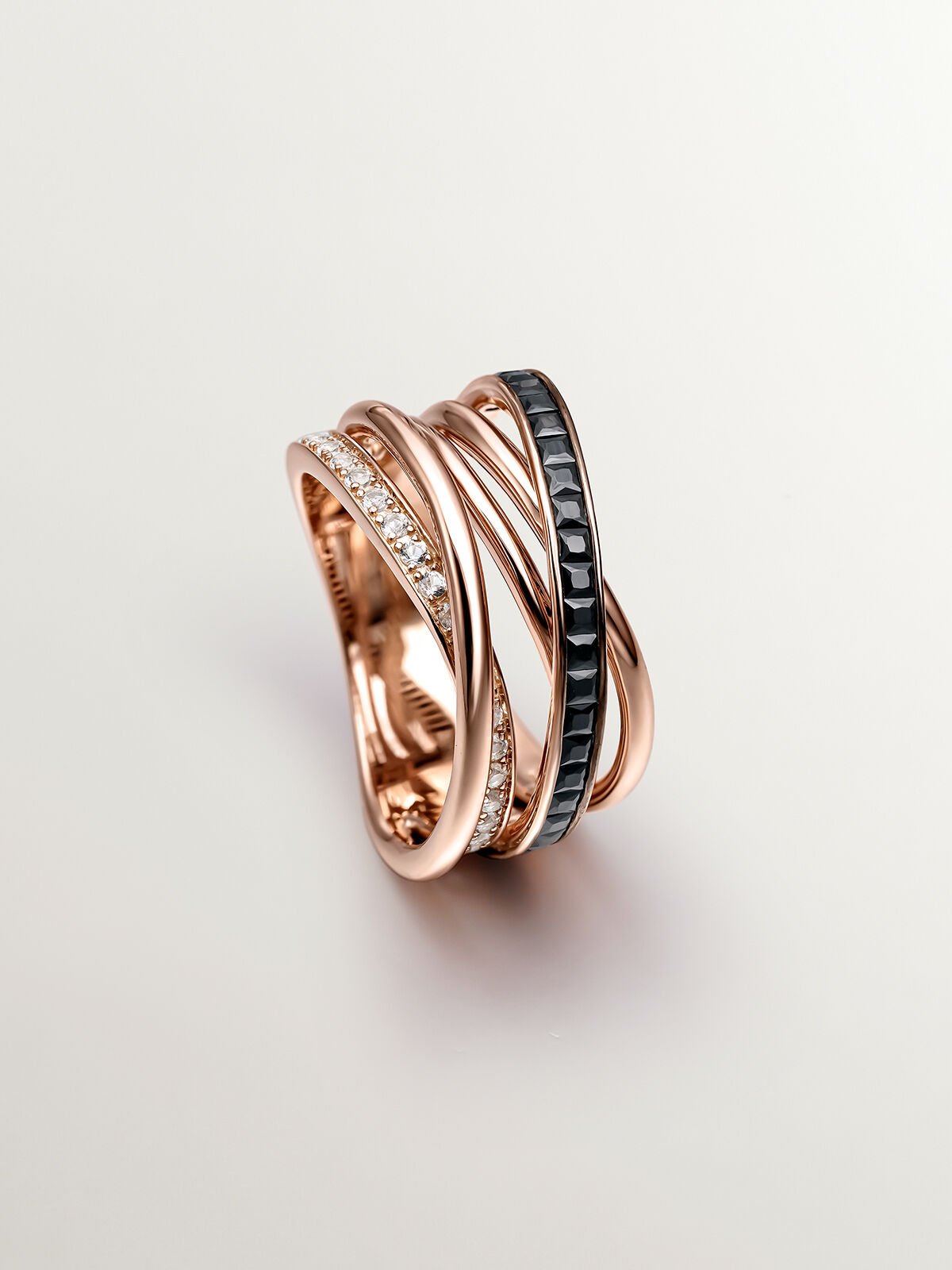 Anillo multibrazo de plata 925 banada en oro rosa de 18K con topacios blancos y espinelas negras