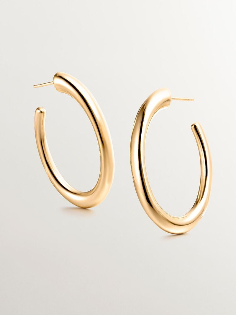 Large hoop earrings made of 925 silver, coated in 18K yellow gold, with an oval shape. image number 4