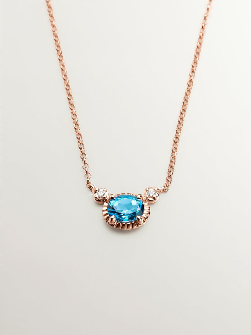 925 Silver pendant dipped in 18K rose gold with London blue and white topazes. image number 0