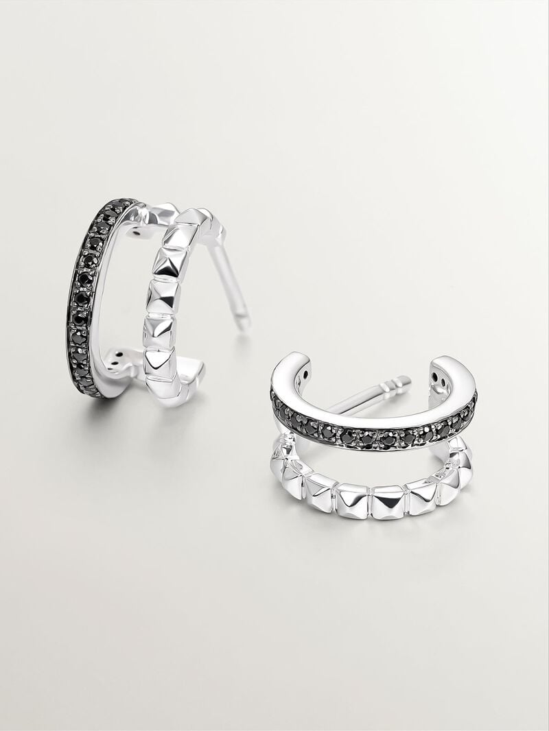 Small double hoop earrings made of 925 silver with embossed detailing and black spinels. image number 4