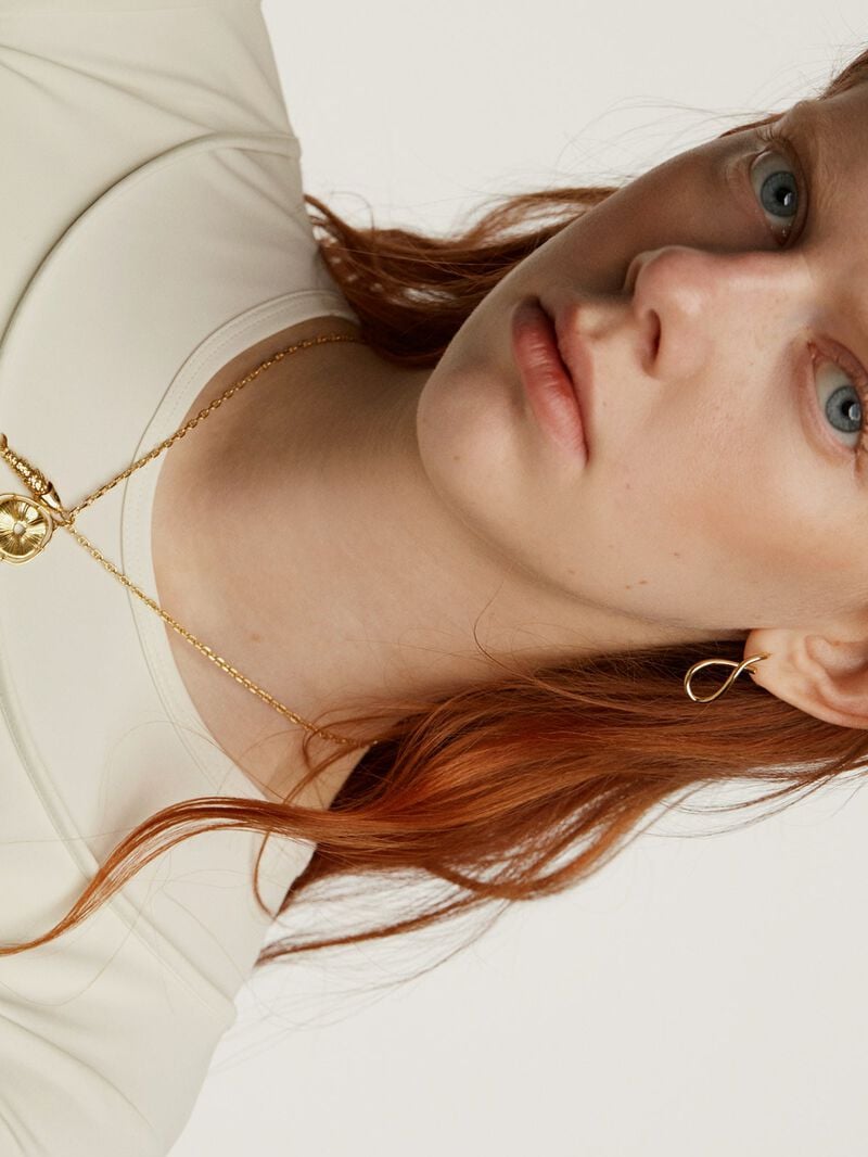 925 Silver charm, gold-plated in 18K yellow gold, with an irregular medallion shape and white topaz stones. image number 5
