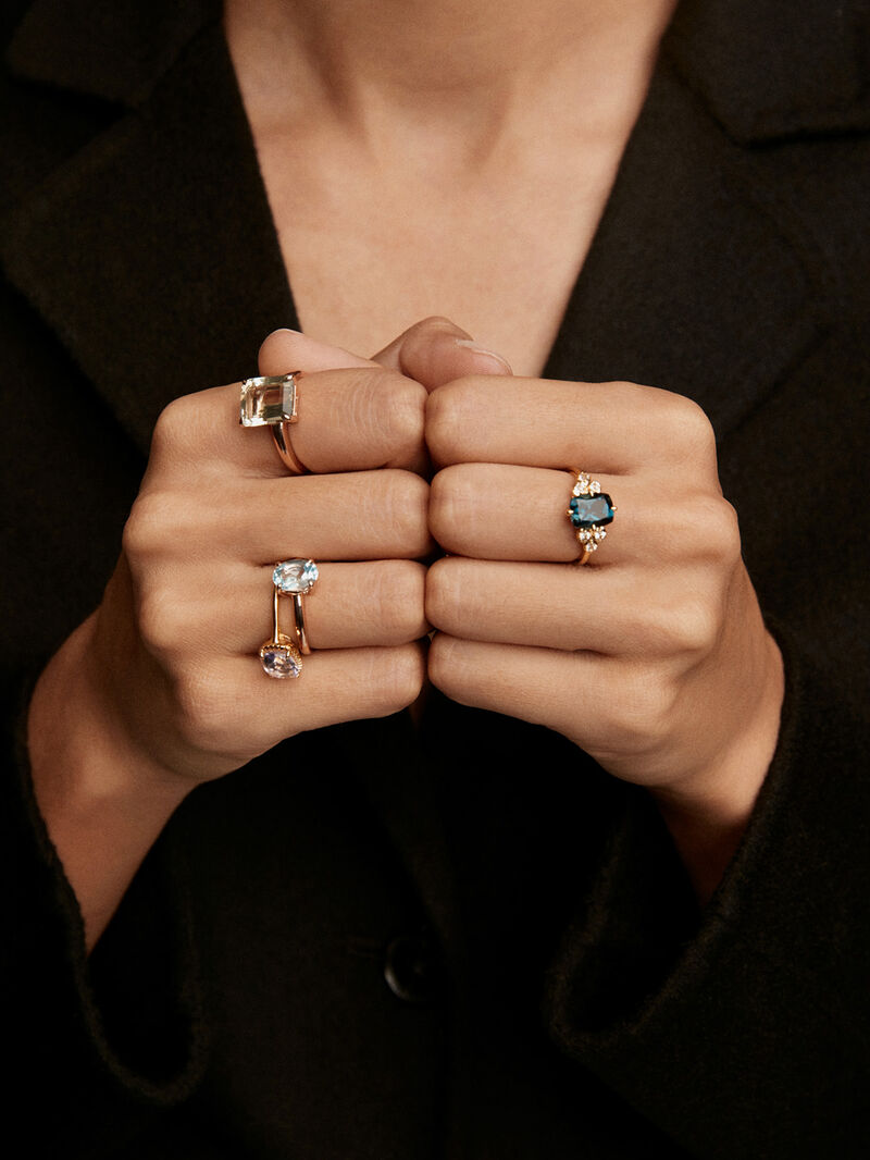 Medium-sized 925 silver hoop earrings plated in 18K rose gold with sky blue topaz. image number 3