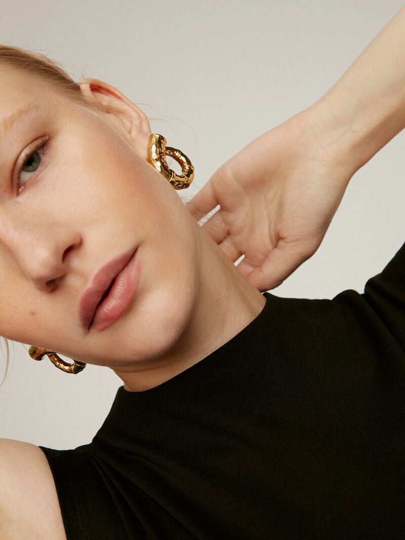Large hoop earrings made of 925 silver, bathed in 18K yellow gold with a bamboo texture. image number 3