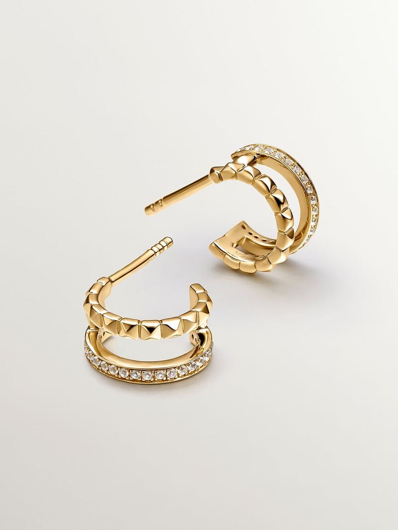Small double hoop earrings made from 925 silver bathed in 18K yellow gold with embossing and white topazes. image number 0