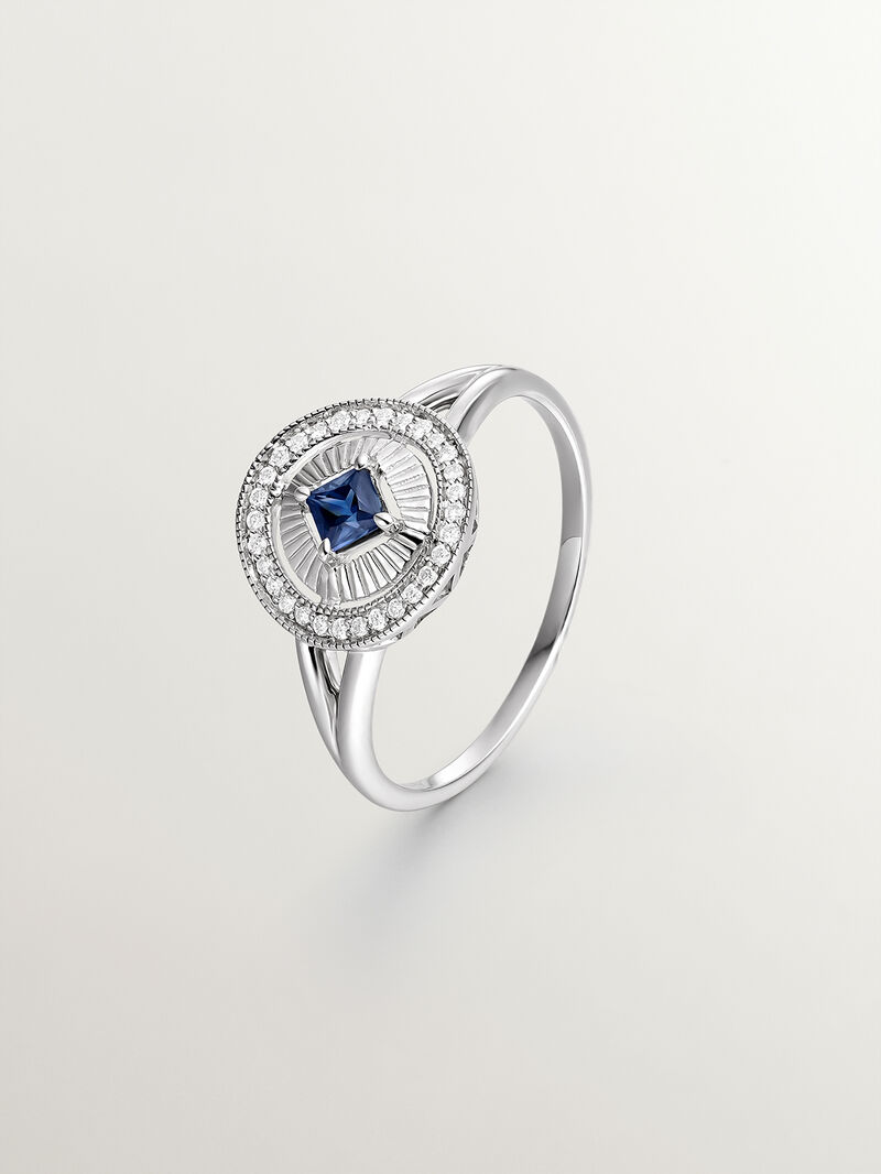 18K white gold ring with brilliant-cut diamonds and princess-cut blue sapphire image number 0
