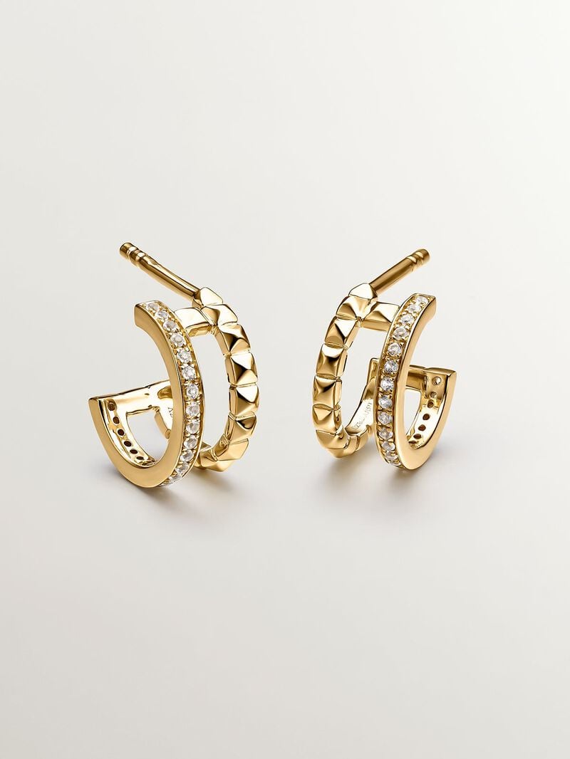 Small double hoop earrings made from 925 silver bathed in 18K yellow gold with embossing and white topazes. image number 2