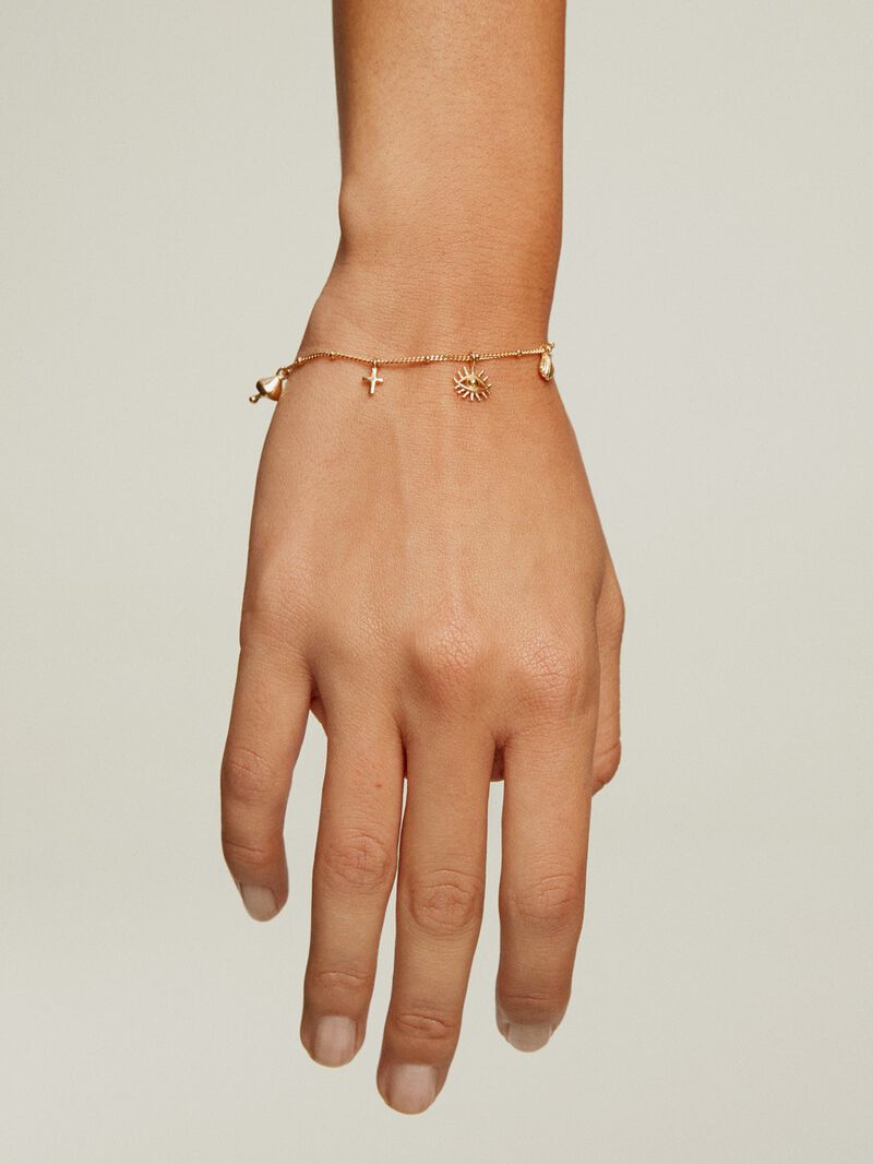 18K yellow gold plated 925 silver bracelet with mushroom, cross, eye, shell, and star motifs. image number 1