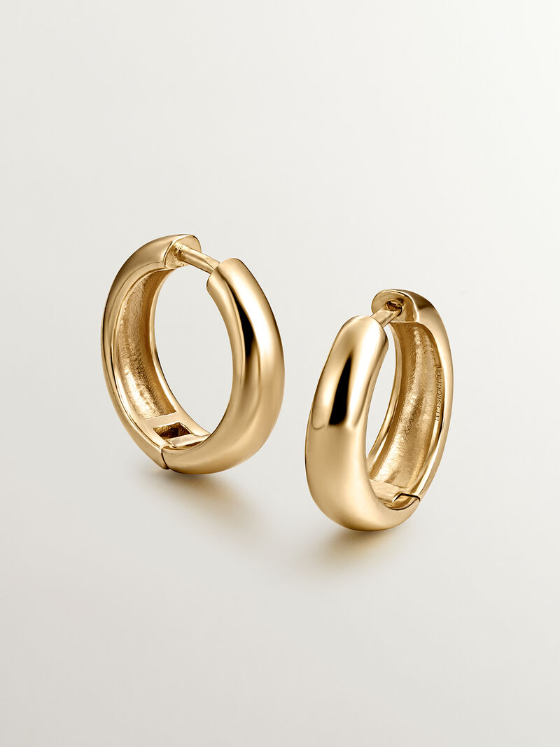 Medium thick hoop earrings made of 925 silver coated in 18K yellow gold. image number 0