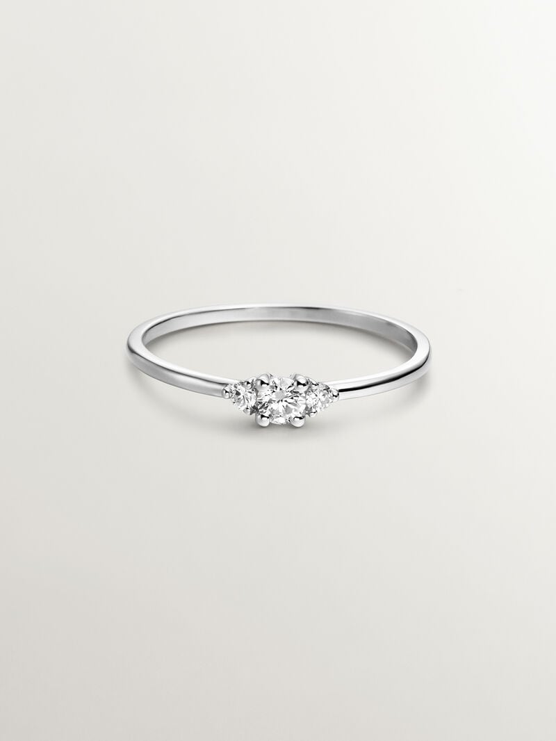 18K white gold trilogy ring with a central diamond of 0.10cts and diamonds image number 2