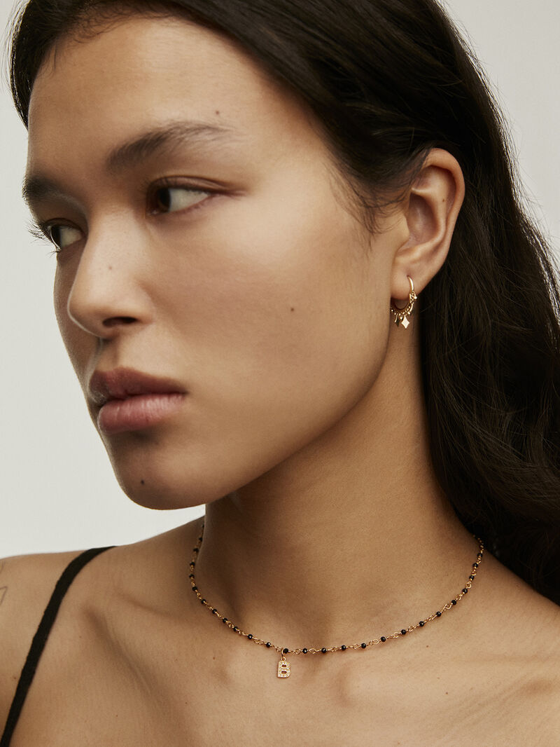 Initial B charm, made of 925 silver coated in 18K yellow gold and adorned with white topaz. image number 4