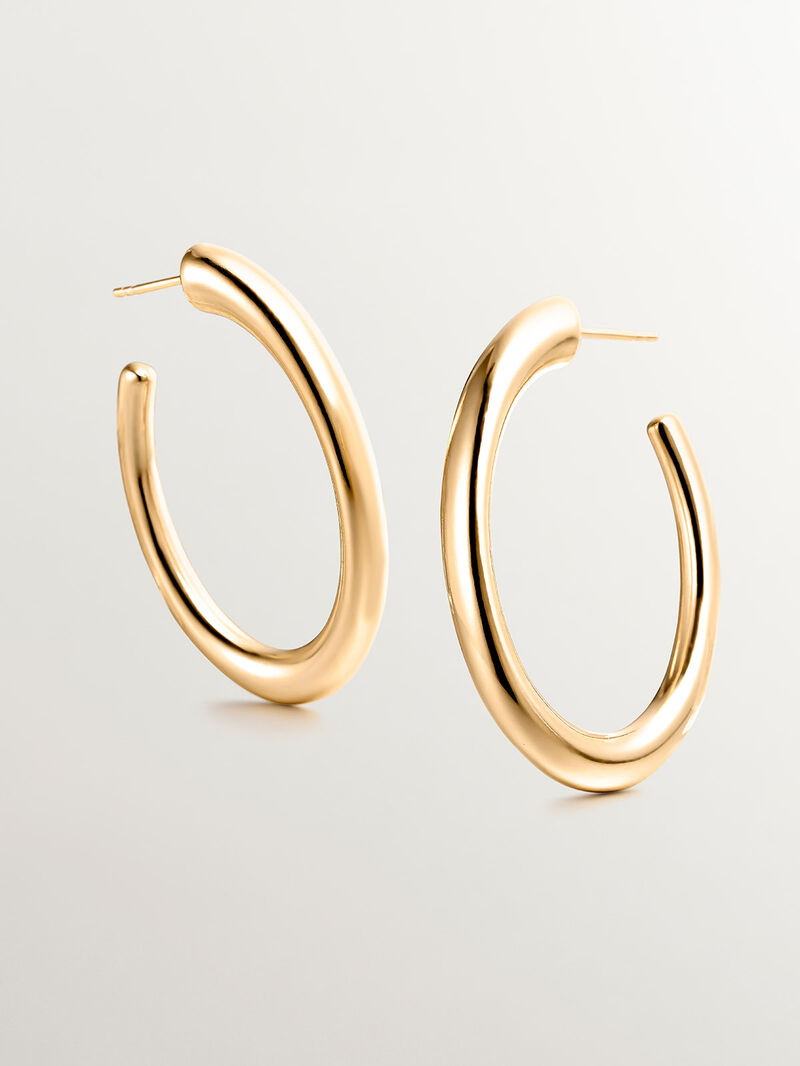 Large hoop earrings made of 925 silver, coated in 18K yellow gold, with an oval shape. image number 4