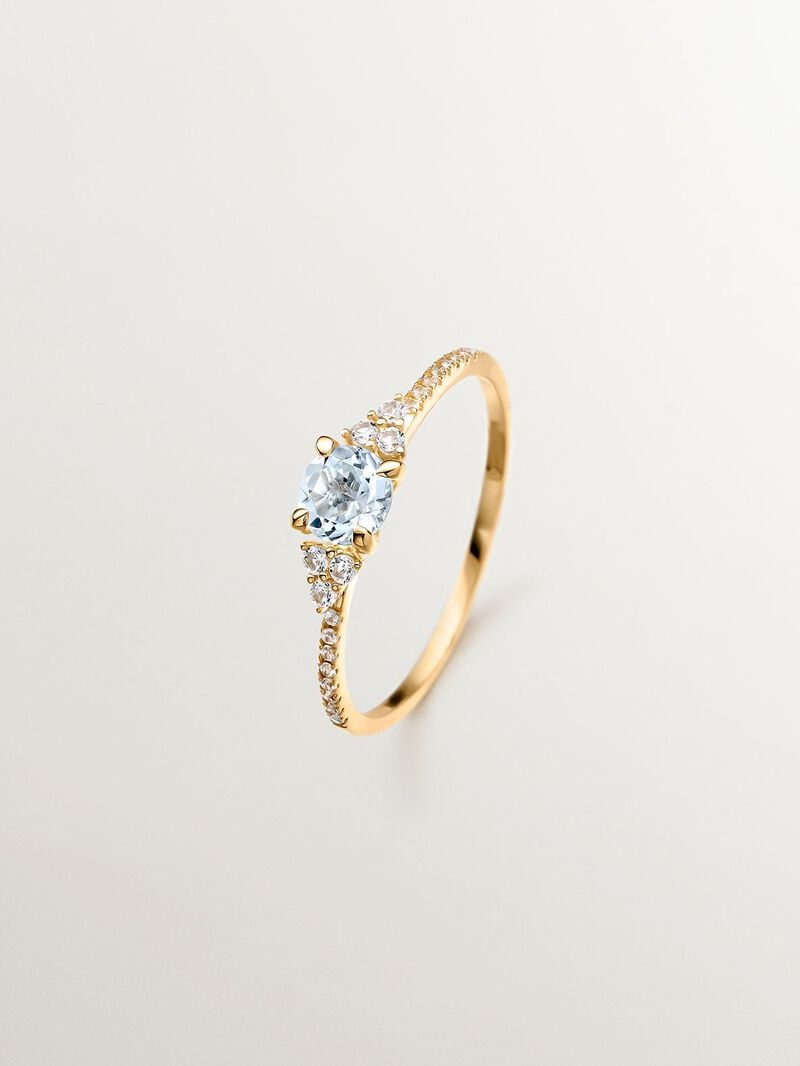 925 Silver ring bathed in 18K yellow gold with sky blue topaz and white sapphires. image number 0