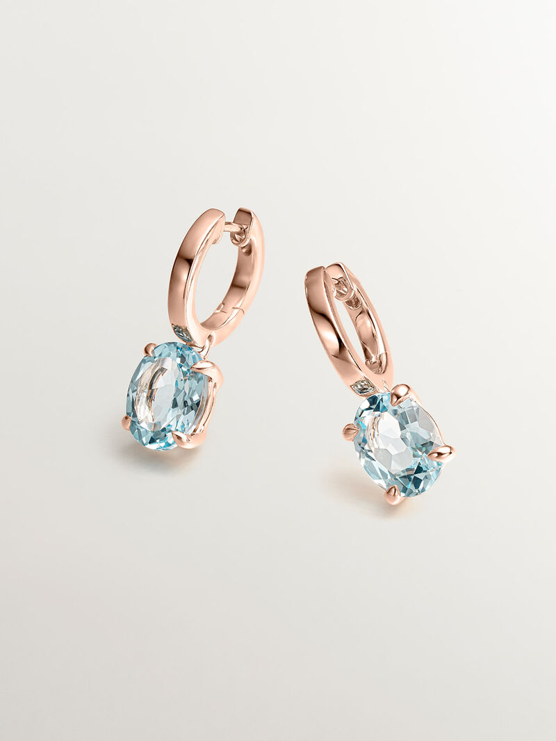 925 Silver earrings plated in 18K rose gold with sky blue topaz. image number 1